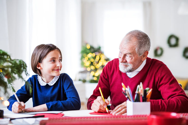 A Small Girl And Her Grandfather Writing Christmas Kums8cw